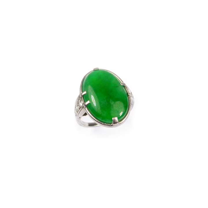 Single stone oval jade and diamond ring
